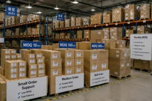 A warehouse filled with stacked cardboard boxes labeled for MOQ options of 10, 100, and 500 pieces, highlighting flexible order sizes and delivery services.