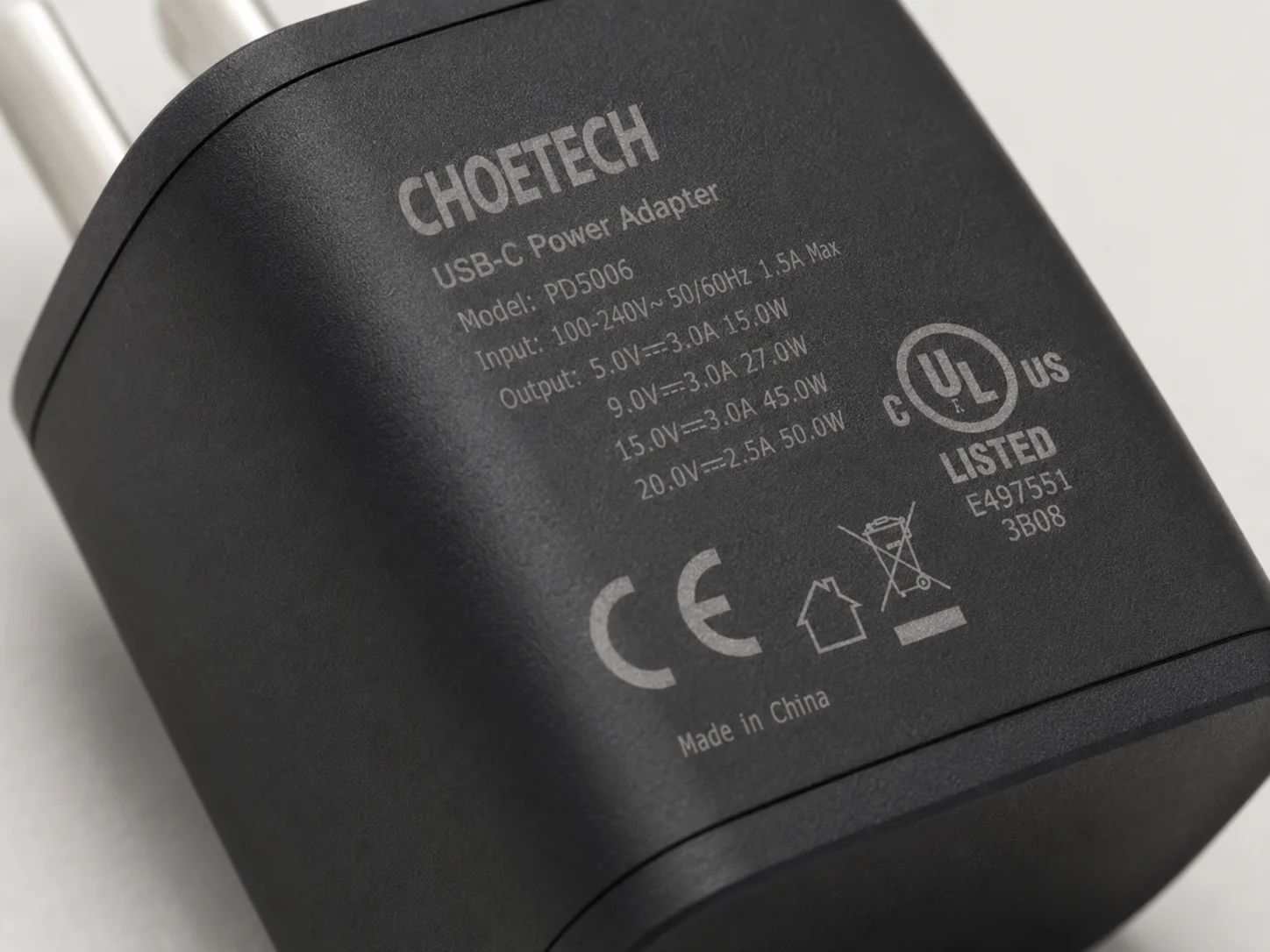 Close-up of safety certification marks like UL, CE on a charger