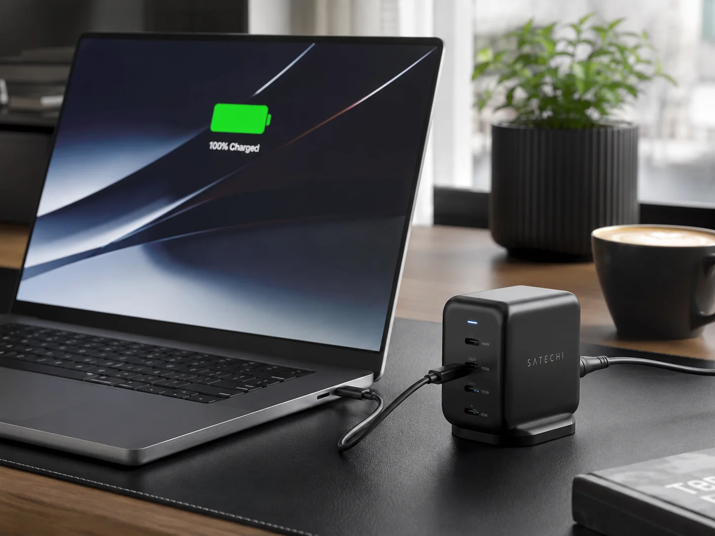 Power-Hungry Laptop Charging a high-end laptop plugged into a multi-port GaN charger