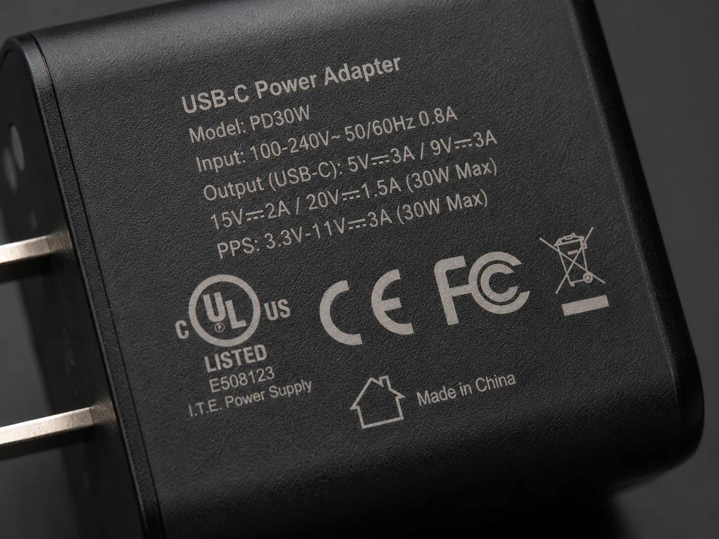 Safety certification logos like UL, CE, and FCC on a charger