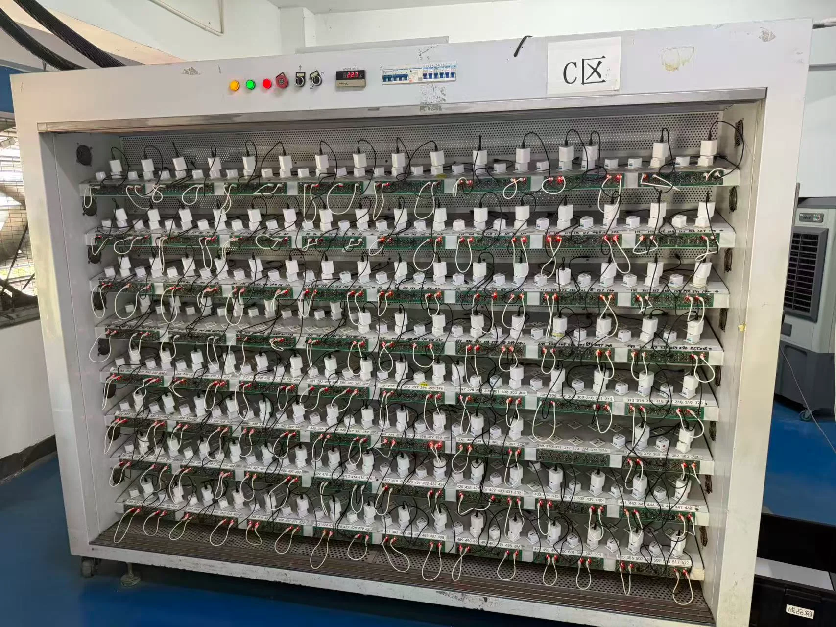 Chargers on an aging and testing rack running under continuous load