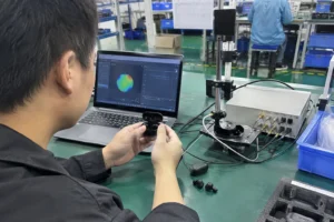 TWS Beamforming: Mic Geometry, Algorithms and Production Tolerance — realistic product and workbench photograph — Featur